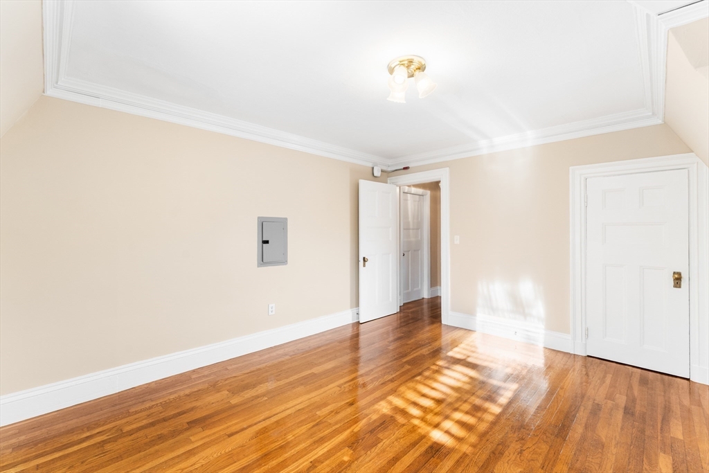 131 Irving Avenue, Unit 3 Providence, RI 02906 - Photo 4 of 14 a view of an empty room and wooden floor