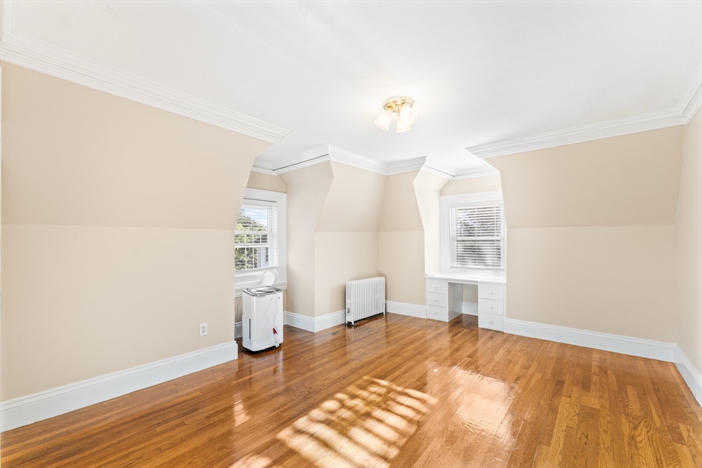 131 Irving Avenue, Unit 3 Providence, RI 02906 - Photo 6 of 14 a bedroom with a bed and a window