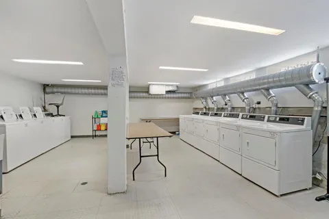 a kitchen with cabinets and window