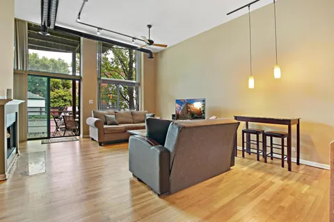 a living room with furniture and windows