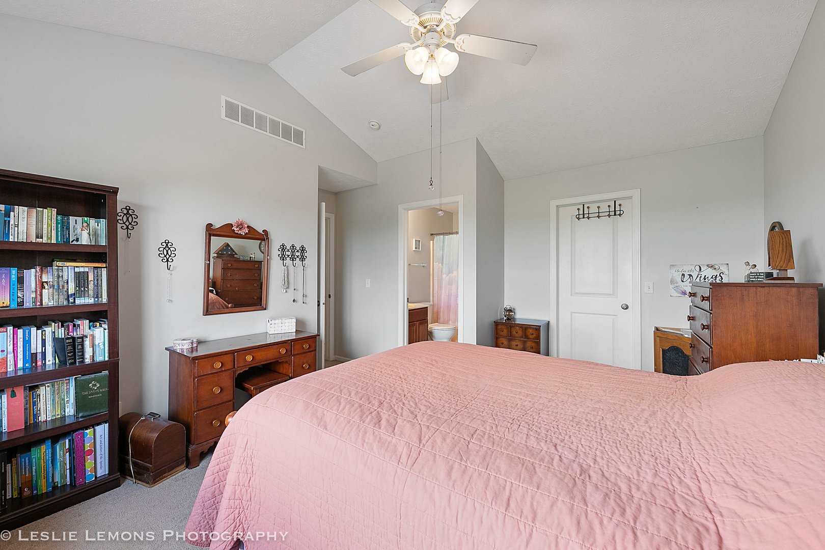 581 Stonegate Drive Sycamore, IL 60178 - Photo 12 of 23 a bedroom with a bed cabinets and book shelf