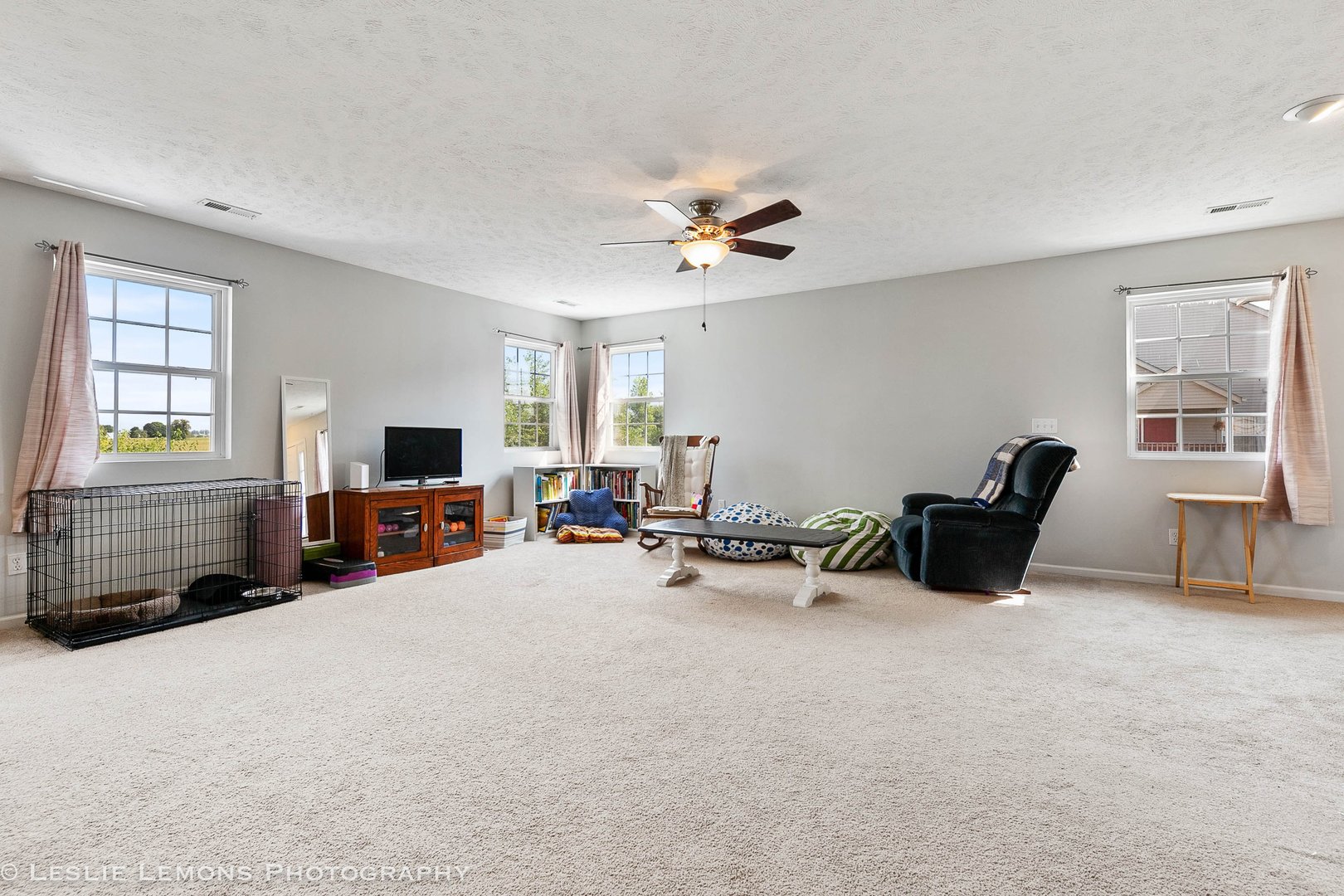 581 Stonegate Drive Sycamore, IL 60178 - Photo 16 of 23 a living room with furniture and a flat screen tv