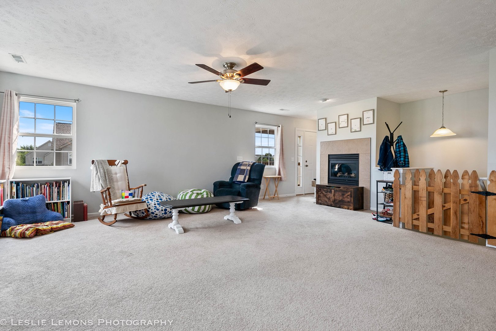 581 Stonegate Drive Sycamore, IL 60178 - Photo 17 of 23 a living room with furniture and a fireplace