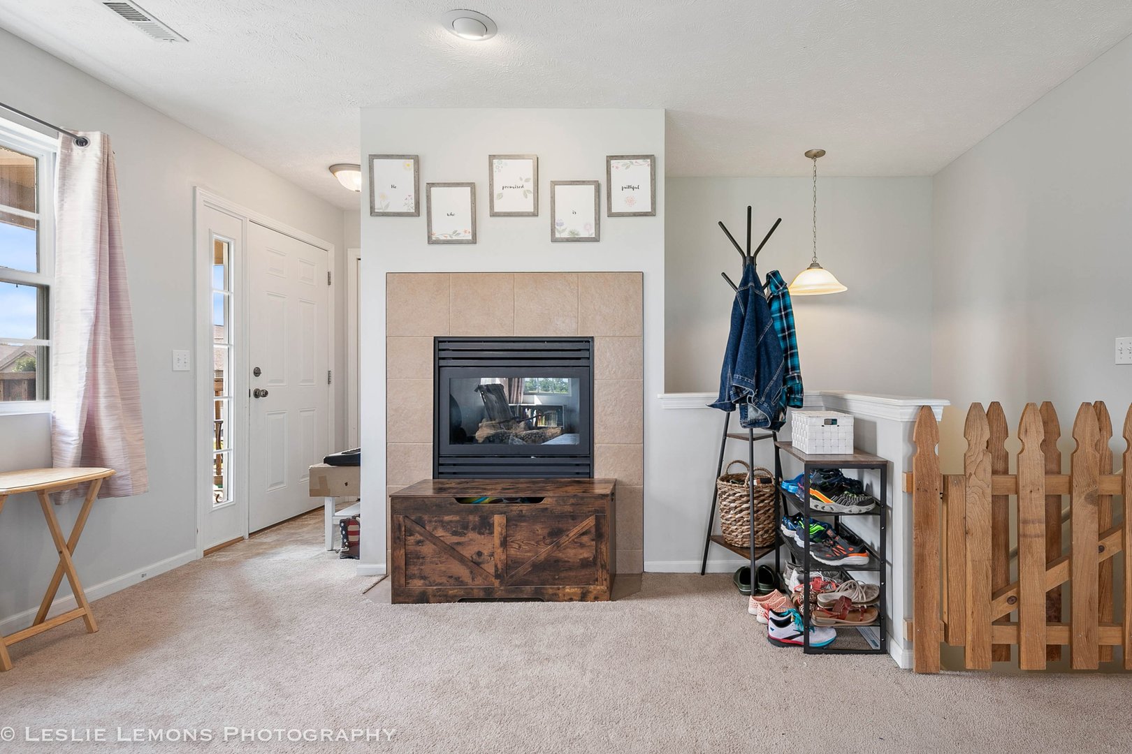581 Stonegate Drive Sycamore, IL 60178 - Photo 20 of 23 a living room with furniture a fireplace and a window