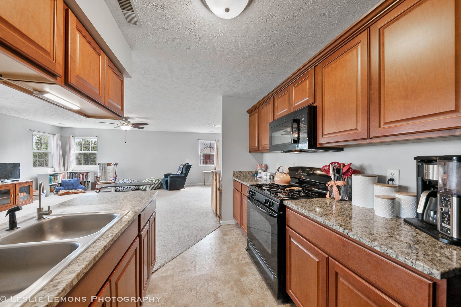 581 Stonegate Drive Sycamore, IL 60178 - Photo 5 of 23 a kitchen with stainless steel appliances granite countertop a sink stove and cabinets