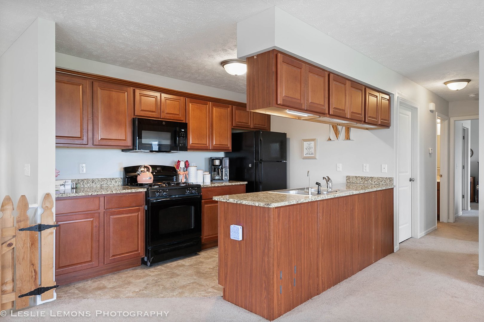 581 Stonegate Drive Sycamore, IL 60178 - Photo 7 of 23 a kitchen with stainless steel appliances granite countertop a stove top oven a sink a refrigerator and a cabinets