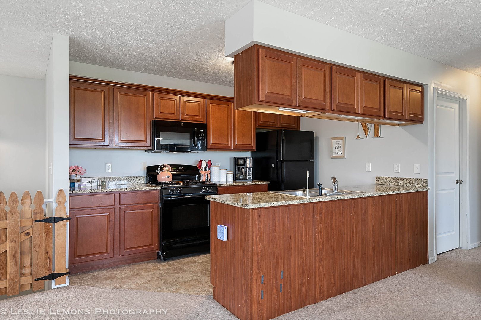 581 Stonegate Drive Sycamore, IL 60178 - Photo 8 of 23 a kitchen with stainless steel appliances granite countertop a stove top oven a sink dishwasher and a microwave oven on the blue kitchen countertops