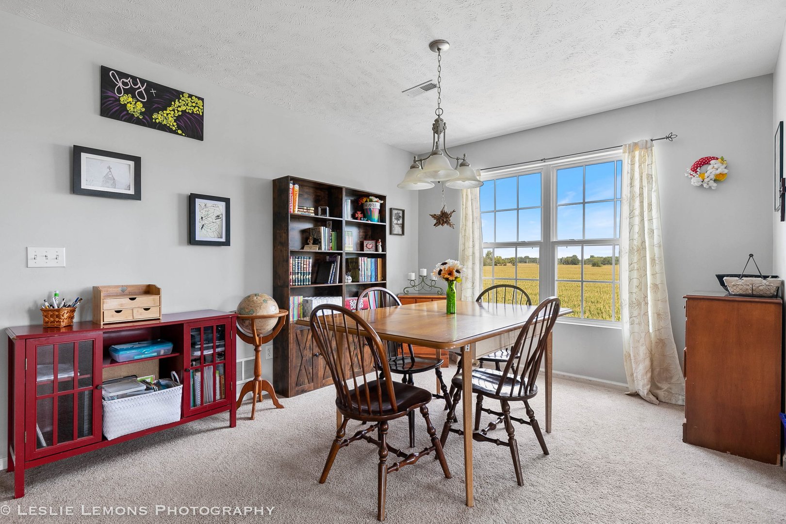 581 Stonegate Drive Sycamore, IL 60178 - Photo 10 of 23 a view of a dining room with furniture and chandelier