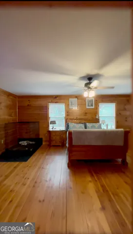 a room with furniture and a wooden floor