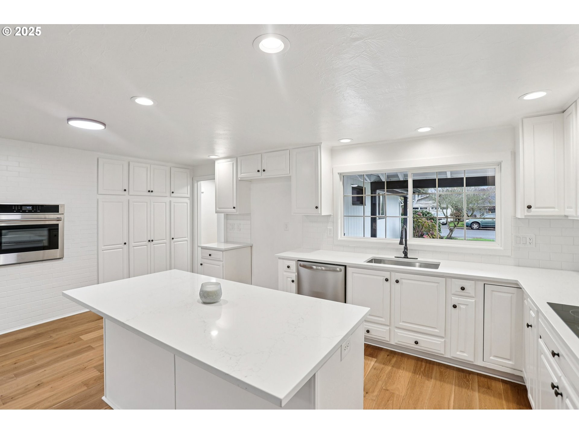 870 Rafael Avenue North Keizer, OR 97303 - Photo 14 of 37 a kitchen with a sink a stove a refrigerator and white cabinets