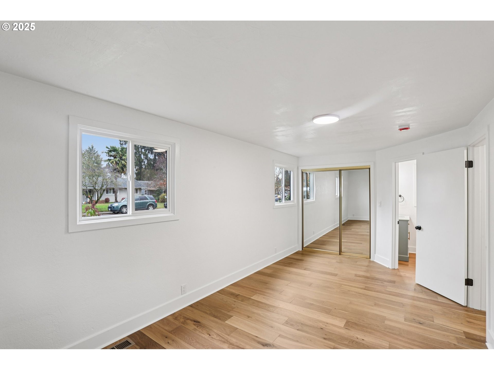 870 Rafael Avenue North Keizer, OR 97303 - Photo 26 of 37 a view of an empty room with wooden floor and a window
