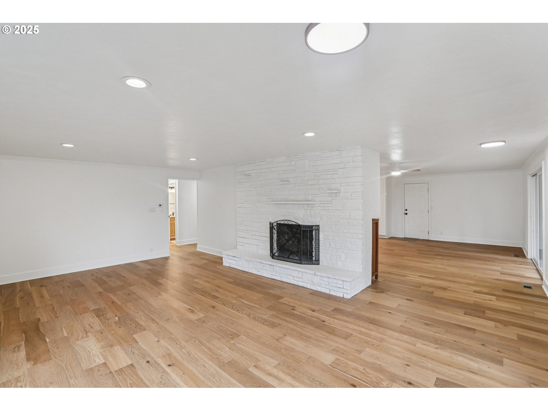 870 Rafael Avenue North Keizer, OR 97303 - Photo 8 of 37 a view of an empty room with wooden floor and fan