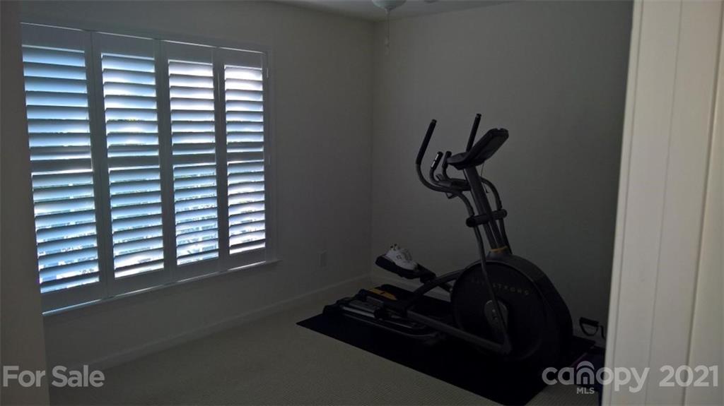 311 Matthews Estates Road Matthews, NC 28105 - Photo 22 of 27 a room with a window and a bicycle