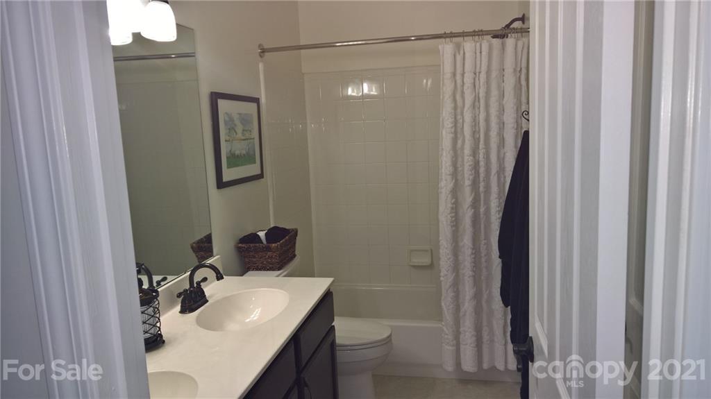 311 Matthews Estates Road Matthews, NC 28105 - Photo 24 of 27 a bathroom with a sink toilet and shower