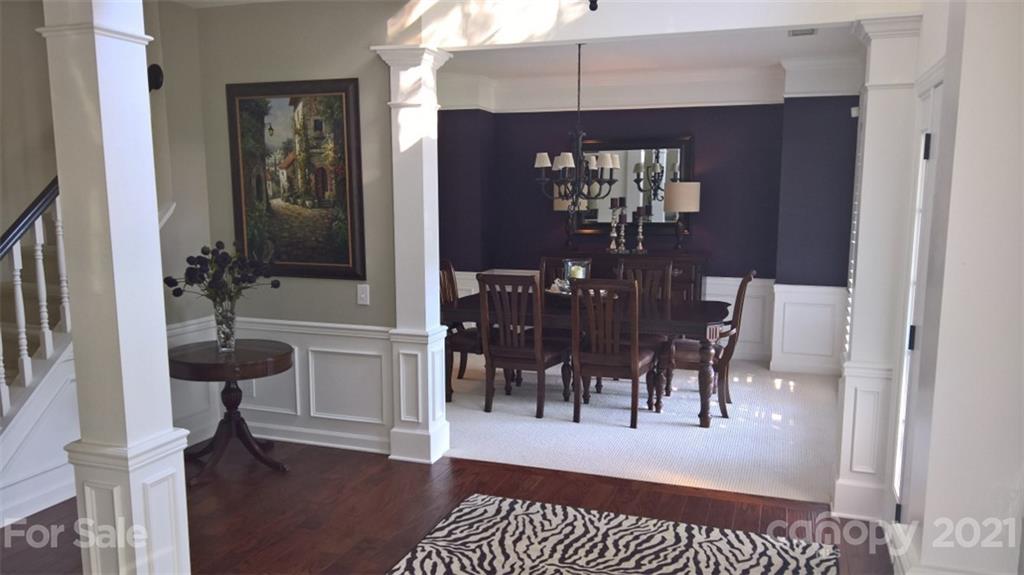 311 Matthews Estates Road Matthews, NC 28105 - Photo 4 of 27 a view of living room and kitchen with furniture wooden floor and a rug