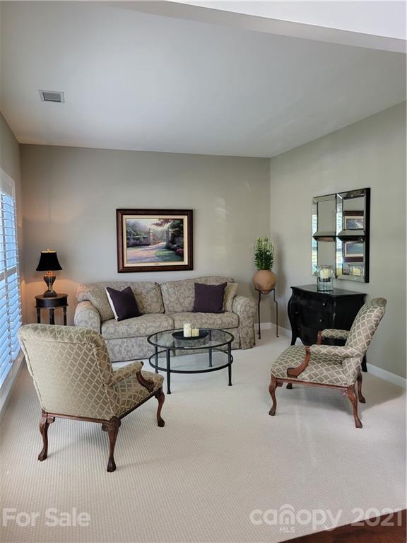 311 Matthews Estates Road Matthews, NC 28105 - Photo 7 of 27 a living room with furniture and a rug