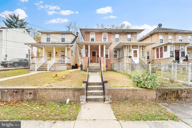 a view of a building with a yard