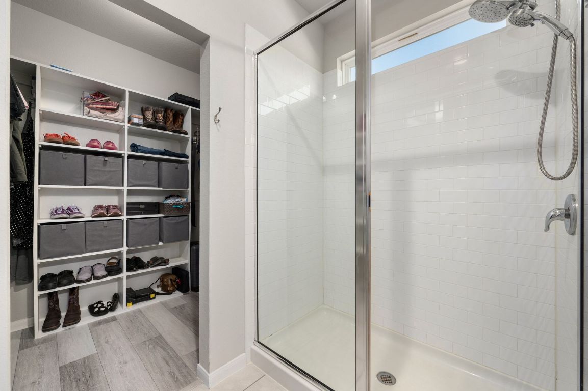 6701 Janes Ranch Road Austin, TX 78744 - Photo 13 of 36 a view of a walk in closet