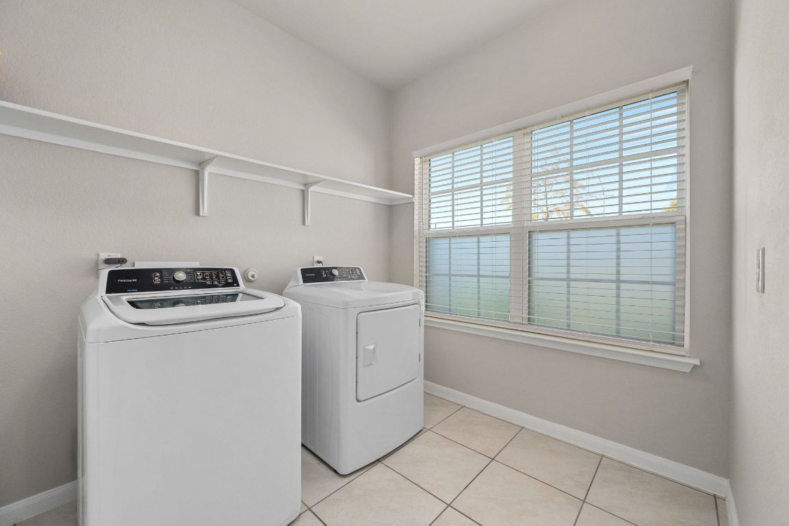 6701 Janes Ranch Road Austin, TX 78744 - Photo 18 of 36 a utility room with dryer and washer