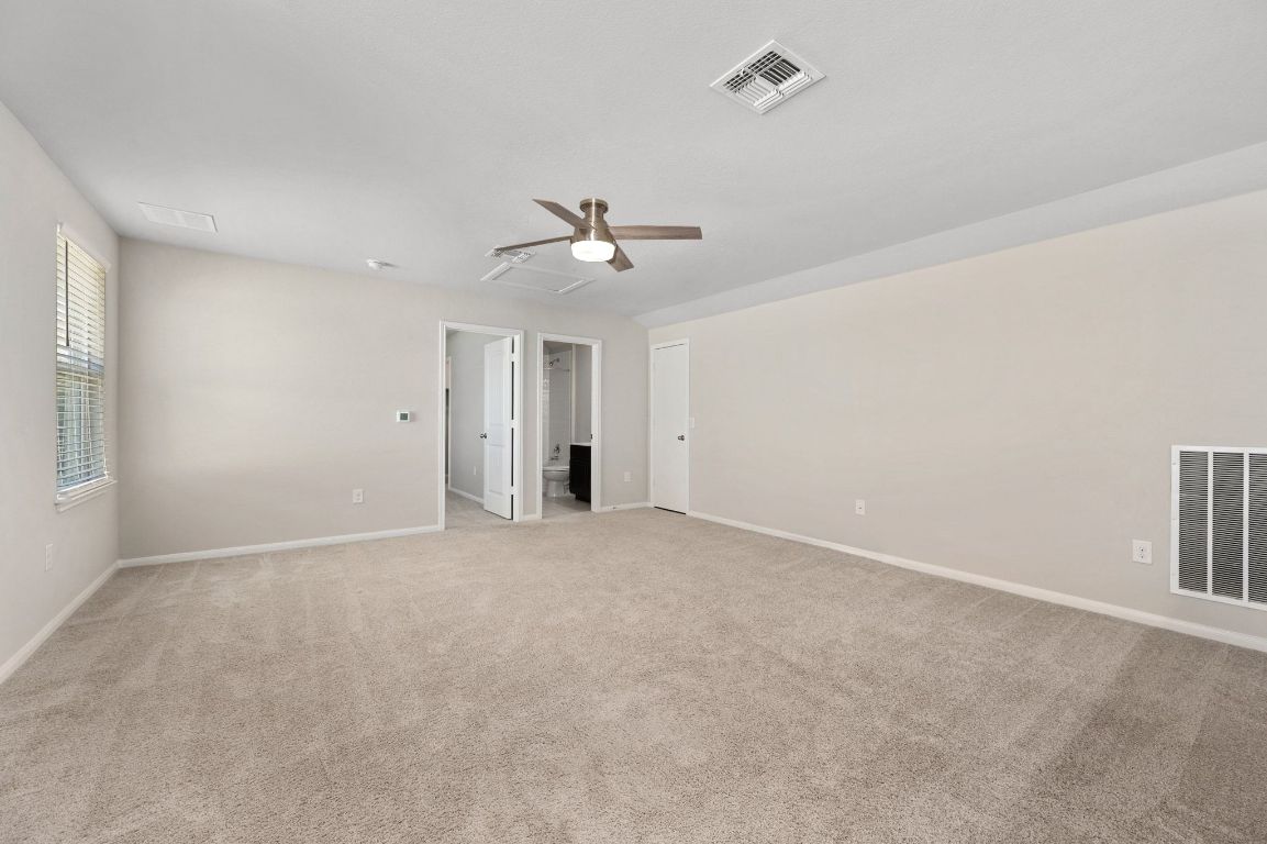 6701 Janes Ranch Road Austin, TX 78744 - Photo 20 of 36 a view of a livingroom with a ceiling fan and window