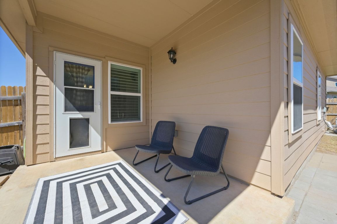 6701 Janes Ranch Road Austin, TX 78744 - Photo 23 of 36 a view of a two chairs in the balcony