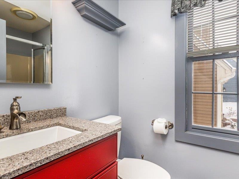 22 Thatcher Lane Galena, IL 61036 - Photo 15 of 24 a bathroom with a granite countertop sink toilet and mirror