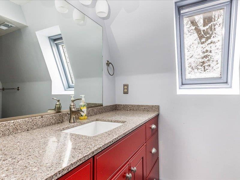 22 Thatcher Lane Galena, IL 61036 - Photo 18 of 24 a bathroom with a granite countertop sink and a mirror