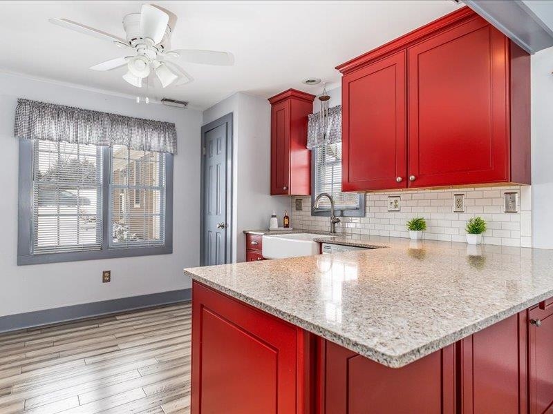 22 Thatcher Lane Galena, IL 61036 - Photo 9 of 24 a kitchen with stainless steel appliances granite countertop a sink dishwasher and microwave with wooden floor