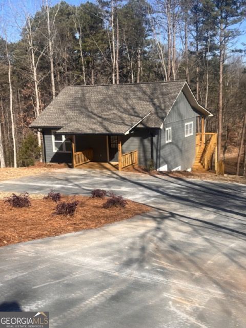 410 Lakeside Hills Road Martin, GA 30557 - Photo 16 of 71 a view of a house with a snow in the yard
