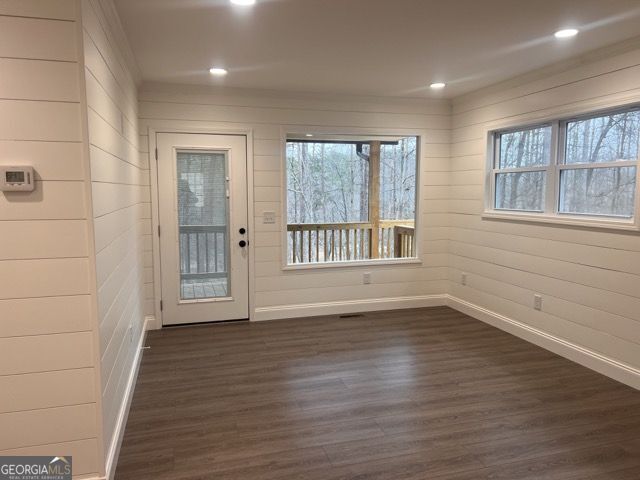410 Lakeside Hills Road Martin, GA 30557 - Photo 17 of 53 a view of an empty room with wooden floor and a window