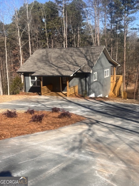 410 Lakeside Hills Road Martin, GA 30557 - Photo 2 of 53 a view of a house with a snow in the yard