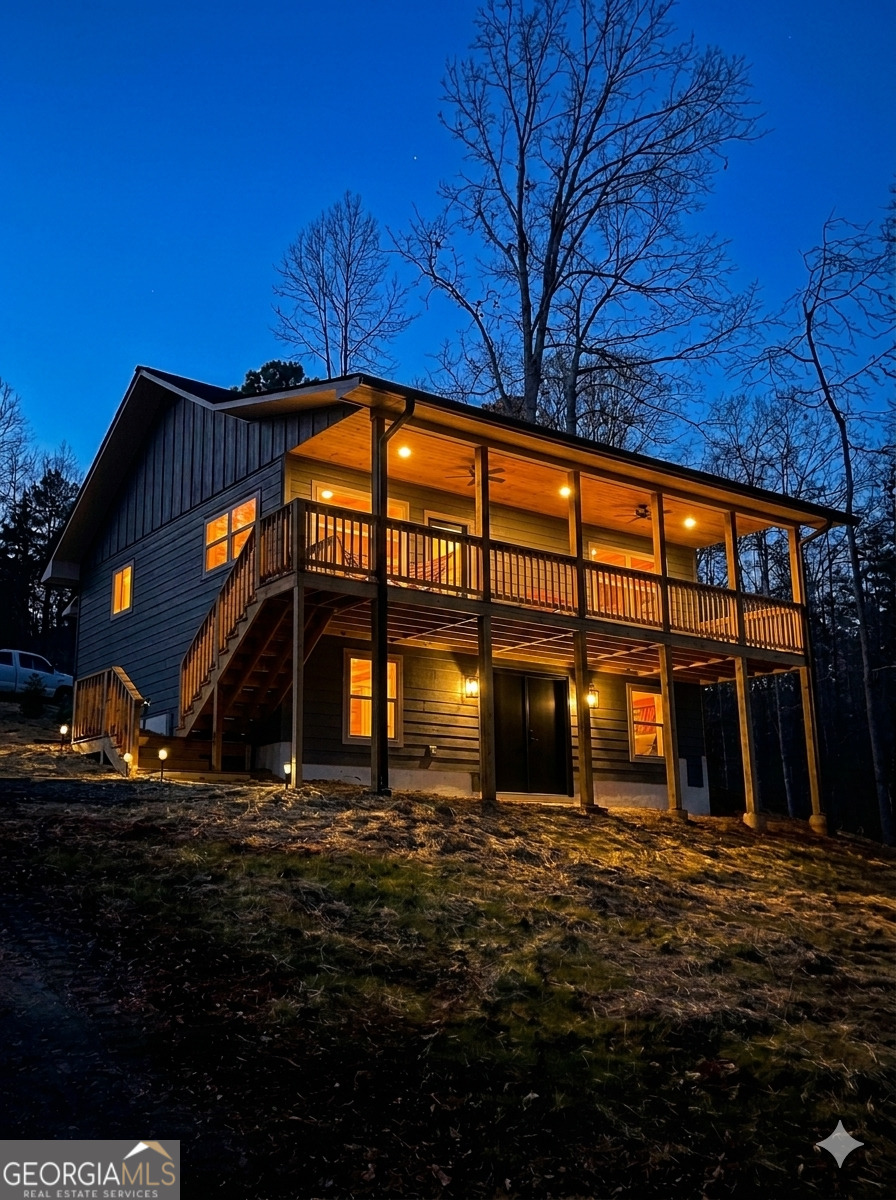 410 Lakeside Hills Road Martin, GA 30557 - Photo 2 of 53 a front view of a house with a yard