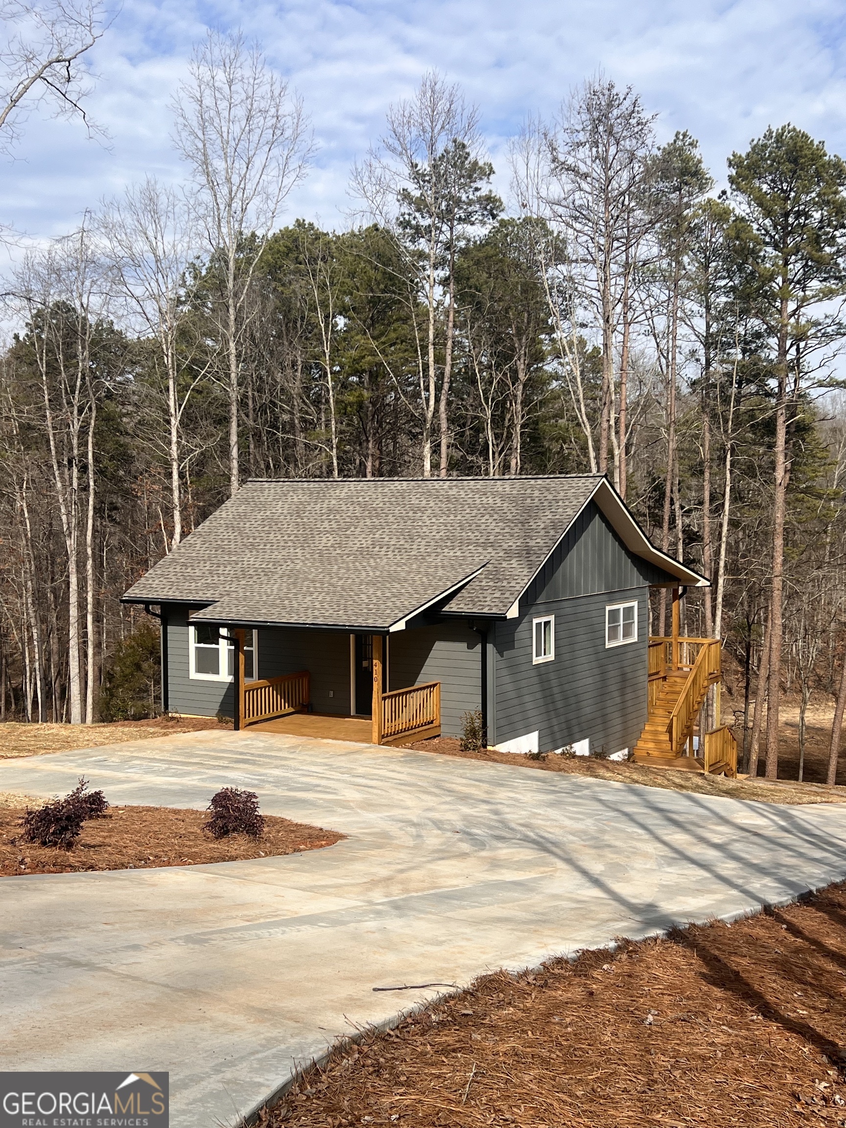 410 Lakeside Hills Road Martin, GA 30557 - Photo 2 of 71 a house with trees in front of it