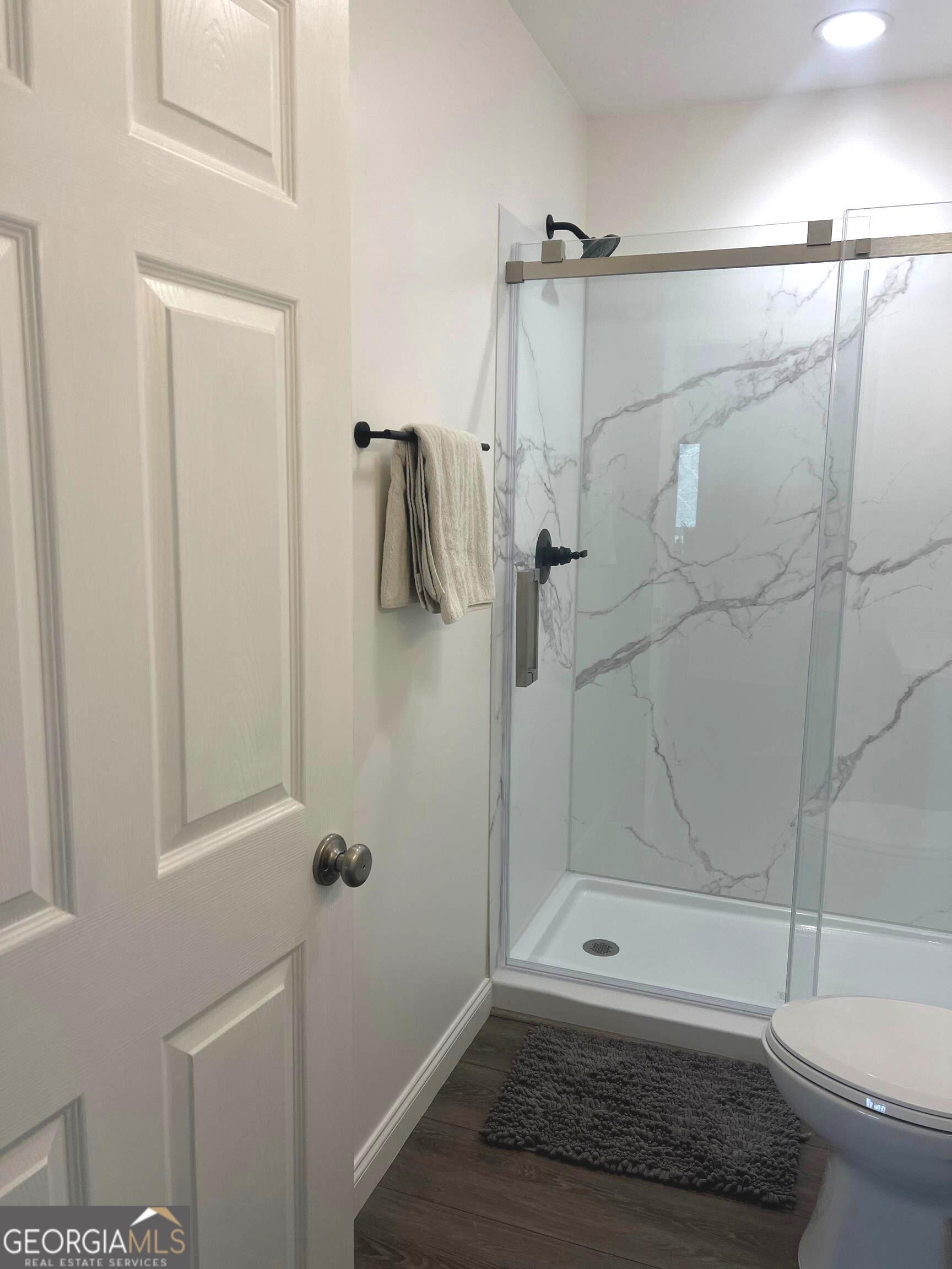 410 Lakeside Hills Road Martin, GA 30557 - Photo 22 of 53 a bathroom with a shower and a toilet