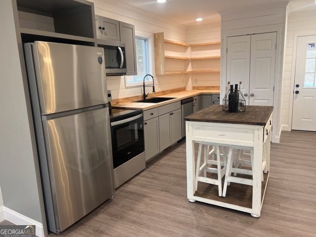 410 Lakeside Hills Road Martin, GA 30557 - Photo 22 of 71 a kitchen with white cabinets and stainless steel appliances