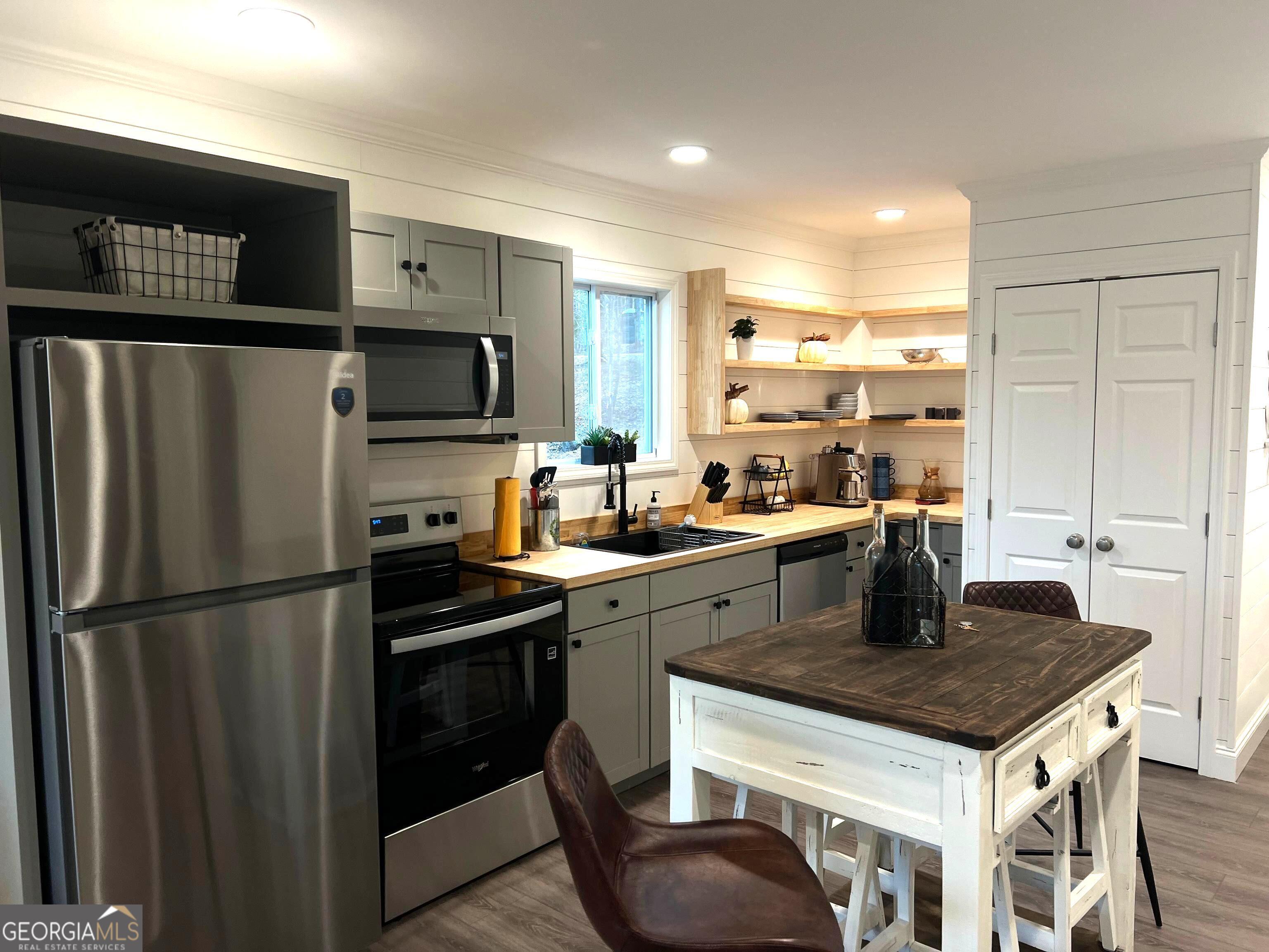 410 Lakeside Hills Road Martin, GA 30557 - Photo 23 of 71 a kitchen with a refrigerator a sink a stove and cabinets