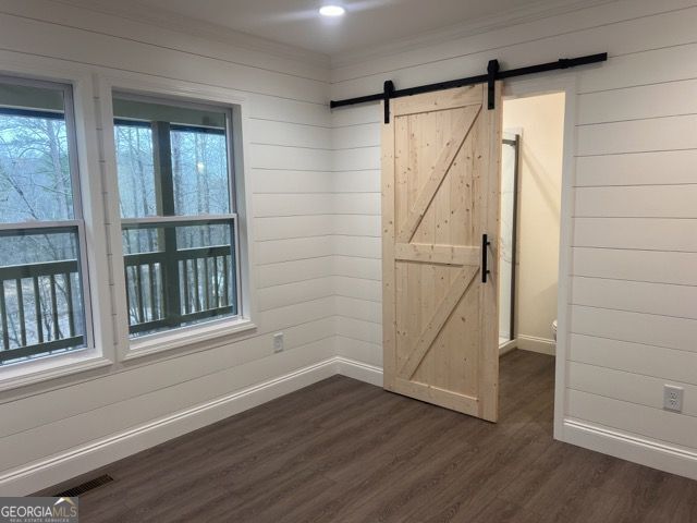 410 Lakeside Hills Road Martin, GA 30557 - Photo 25 of 53 a view of an empty room with wooden floor and a window