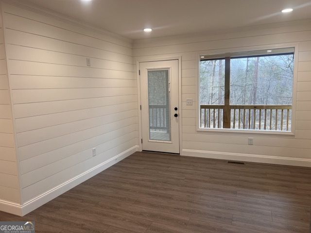 410 Lakeside Hills Road Martin, GA 30557 - Photo 26 of 71 a view of an empty room with wooden floor and a window
