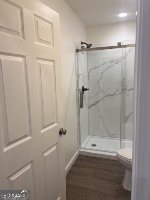 410 Lakeside Hills Road Martin, GA 30557 - Photo 36 of 71 a bathroom with a glass shower door