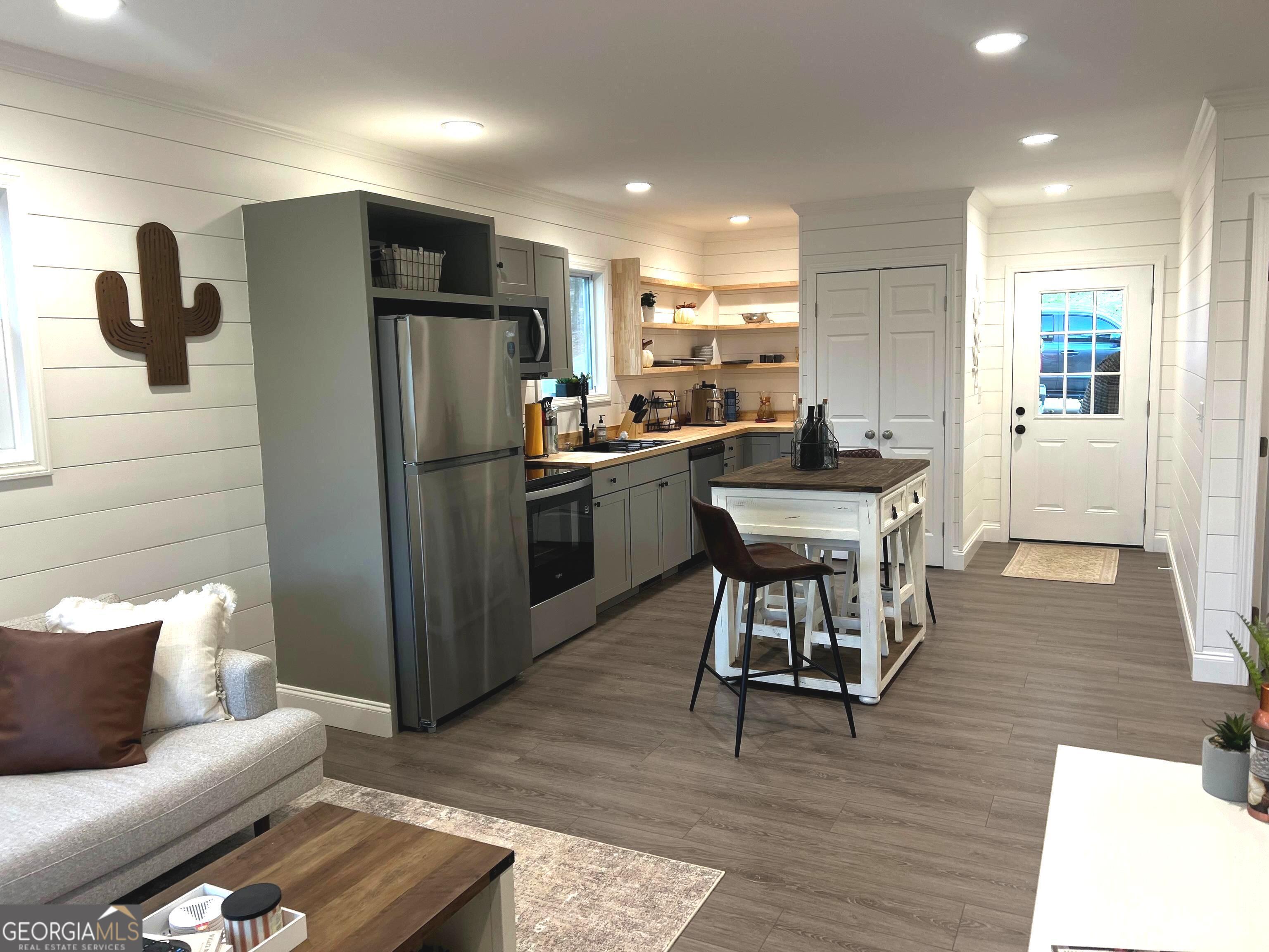 410 Lakeside Hills Road Martin, GA 30557 - Photo 5 of 71 a kitchen with a refrigerator and a wooden cabinets