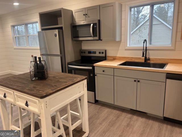 410 Lakeside Hills Road Martin, GA 30557 - Photo 5 of 53 a kitchen with stainless steel appliances granite countertop a sink and a microwave