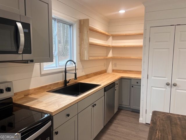 410 Lakeside Hills Road Martin, GA 30557 - Photo 5 of 53 a kitchen with a sink and cabinets