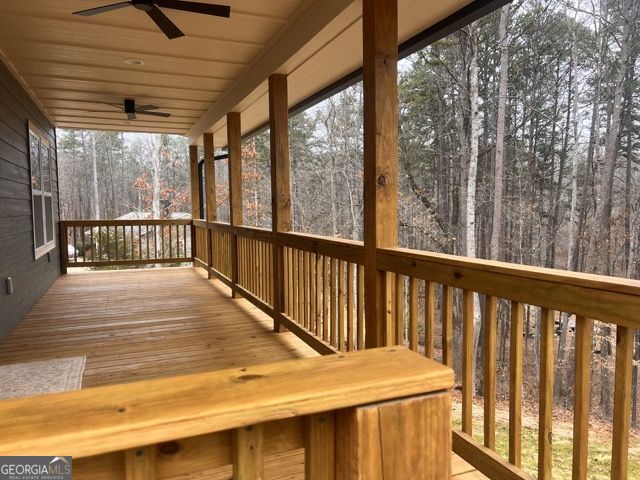 410 Lakeside Hills Road Martin, GA 30557 - Photo 6 of 53 a view of a balcony with wooden floor