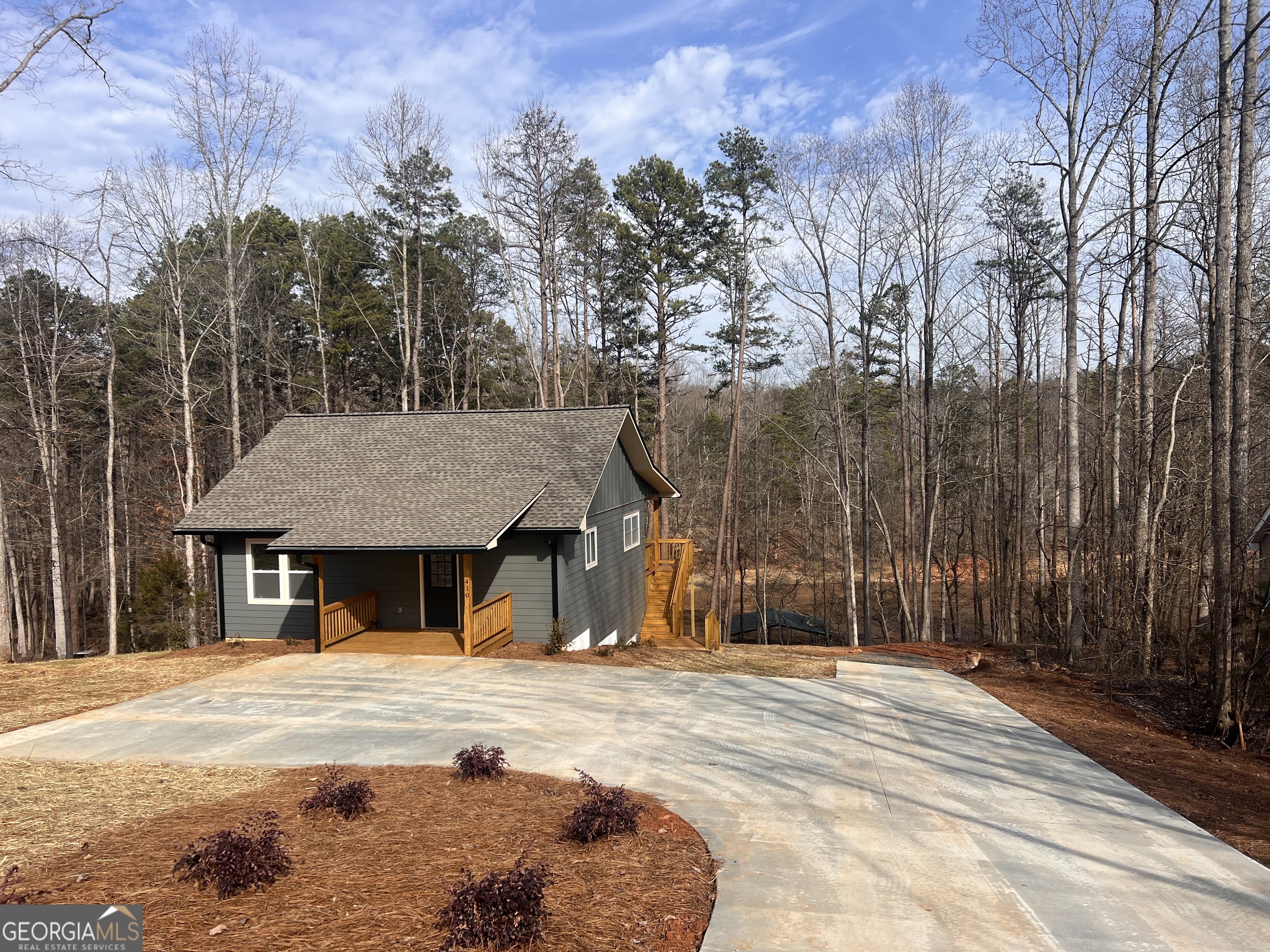410 Lakeside Hills Road Martin, GA 30557 - Photo 68 of 71 a house with trees in front of it