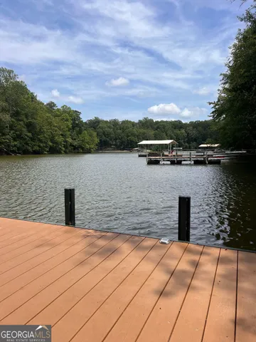 a park with water view and large trees