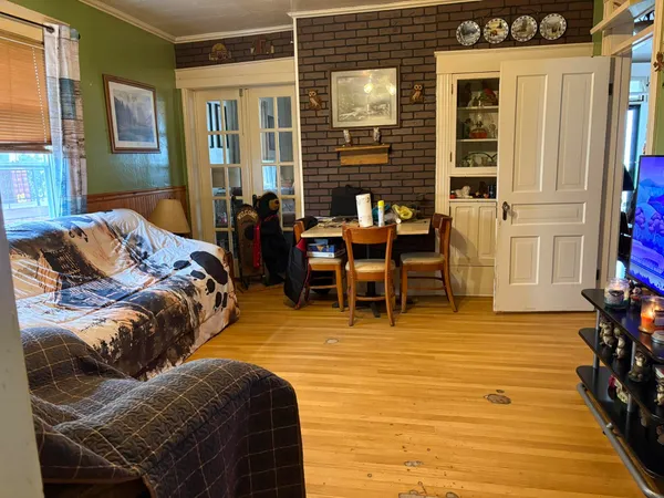 a kitchen with sink refrigerator and window