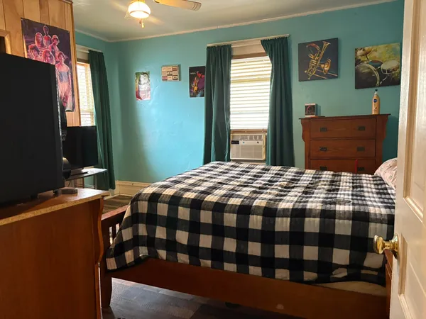 a bedroom with a bed and a table in it