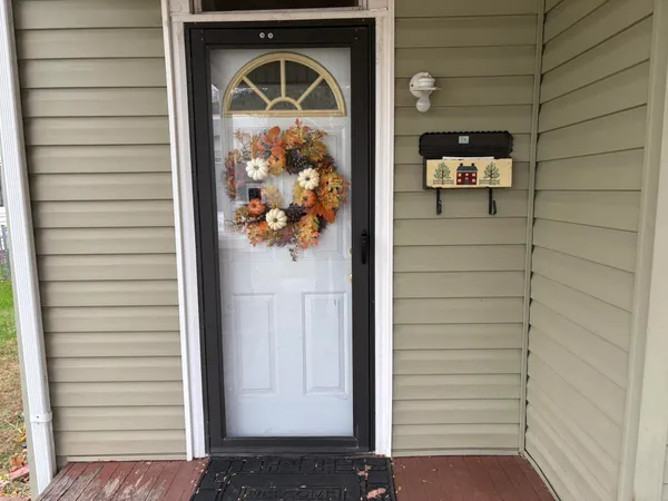 a front view of a house with wooden floor