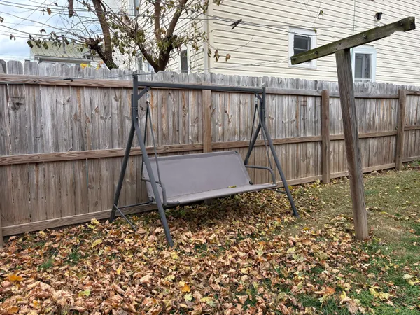 a living room with furniture or chandelier and a window