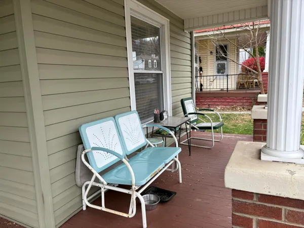 a backyard of a house with outdoor seating